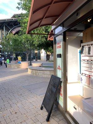 Kiosk near the food court by the water pad.