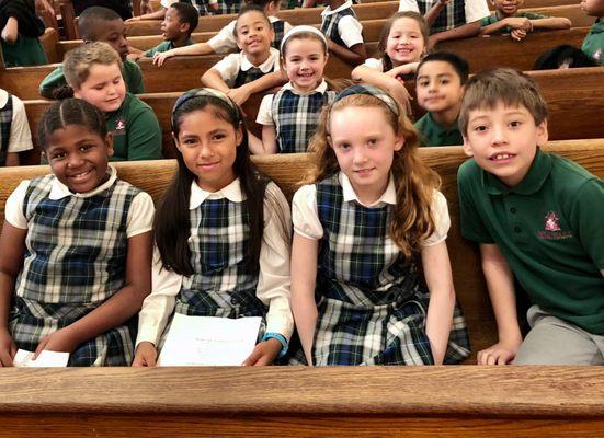 Students attending mass at Sacred Heart of Jesus