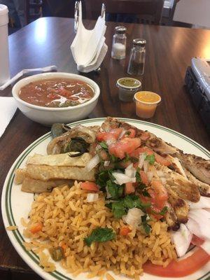 Chicken fajitas, Mexican rice, charro beans, and papas!  Mmmmmm. Oh and the yellow hot sauce, gotta get it if you like it spicy!