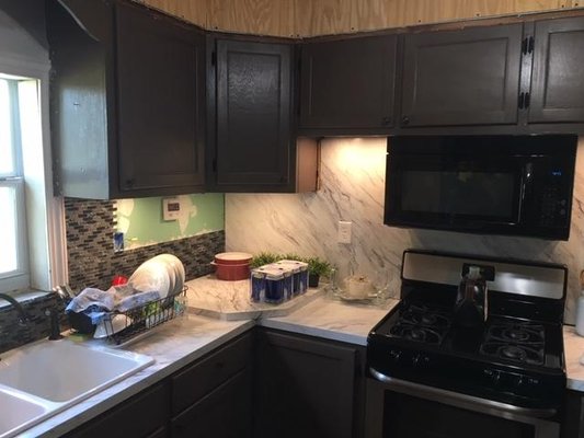 Kitchen remodel with new shelving, tile, lighting etc.