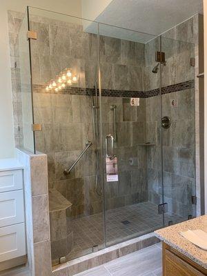 Frameless Glass corner Shower in Clear glass with Brush Nickel Hardware.