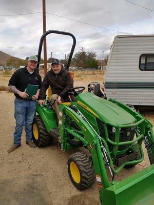 Salesman Sawyer Reifel and I. I'm the good looking one on the tractor.