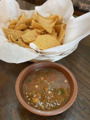 Complimentary chips and salsa  Salsa--. 10 to the power of HOT