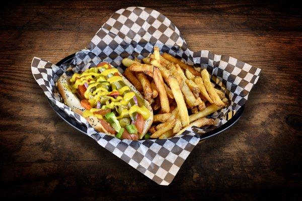 Chicago Dog - 1/4 lb. all beef frank with pickle planks, celery salt, tomato, onion, peppers, giardiniera and mustard on a poppy seed bun.