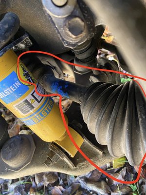 Image of the "NEW" CV Axle that I was charged for. For comparison the yellow strut was replaced by me months earlier.