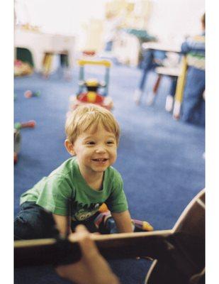 singing with guitar is the best activity at Poppyseed Pre-Nursery