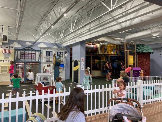 Imagination area to the left, play structure to the right. Enclosed baby play area in front of play structure.