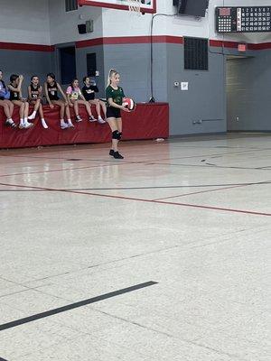 My daughter serving in the volleyball game (august 2022)