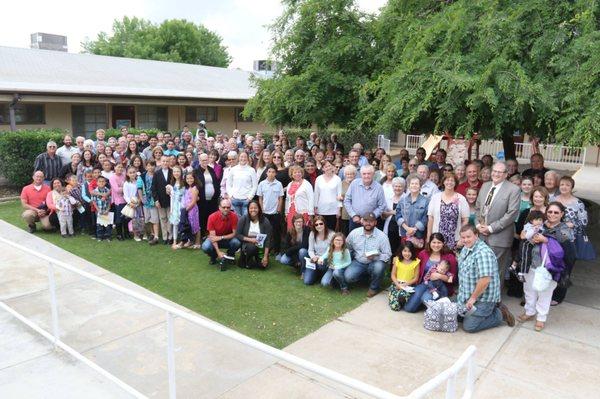 A picture in the courtyard with individuals that make up Valley Bible Church,