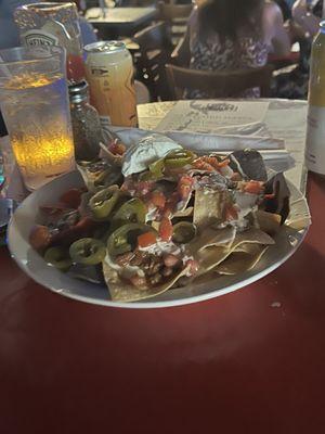 Chili nachos with queso cheese and extra jalapenos