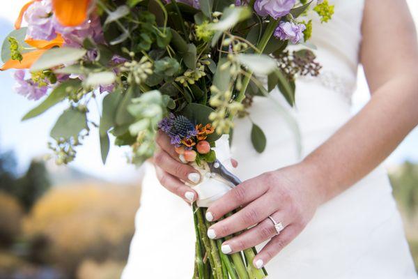 My grandfather passed away after we ordered our flowers. Dore attached his boutonniere to the handle of my bouquet.