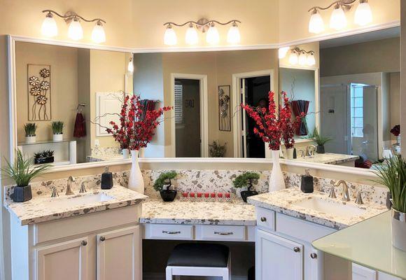 Full bathroom remodel with new cabinets and countertop.