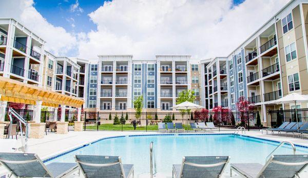 The Flats at Austin Landing offers residents a resort-style pool and upgraded pool-side lounge area