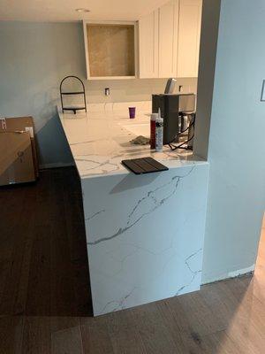 Waterfall at the end of the kitchen counter