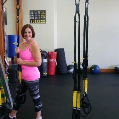 Liz striking a pose. She has lost 150 lbs and is now a certified trainer to help others!