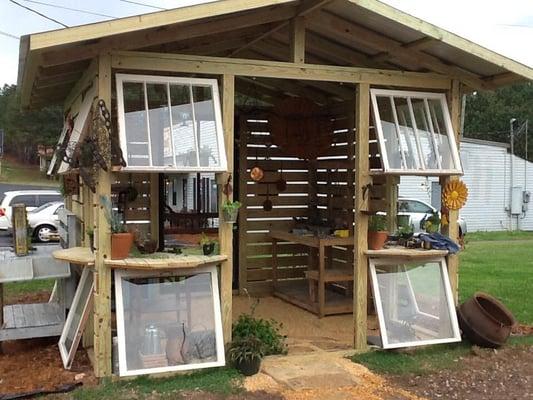 Our garden "shack" featuring succulent plants in interesting containers.