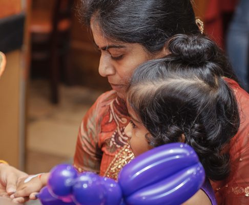 Little girl getting her hand painted at a birthday party!