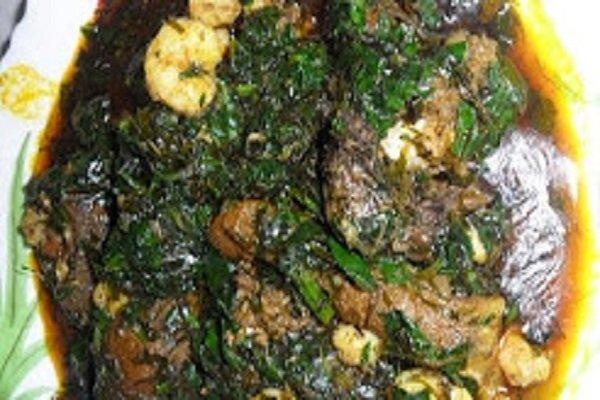 Nigerian Afang Soup ( Spinach and Okazi Leaf Mix in rich palm oil, dried Fish and Assorted meat chunks)