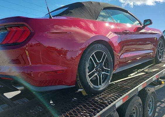 Ford Mustang transported on a 3 car open trailer