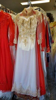 Stunning gold/cream ao dai hanging on the rack