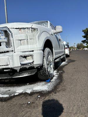 A beautiful foamed up car.