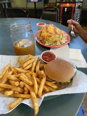 Burger, fries and club salad. Angle shot of salad which is actually much larger than picture shows