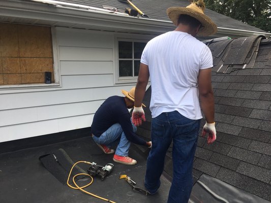 2 of our workers working on the roof today