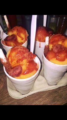 MANGONADAS!  Almost like a mango Italian ice with chamoy & chile! Very yummy & comes in three sizes.  Small, medium & large.