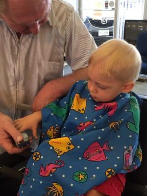 Jimmy letting my son touch the clippers so he knows there's nothing to be afraid of