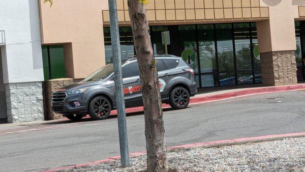 A Mesa Security car parked on red line - decidedly not a cop or a fireman, while he gets out, overweight and graying and stands by the door!