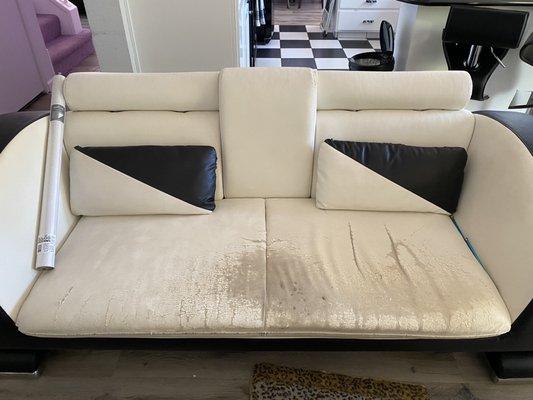 Sofa that needs seating replaced.