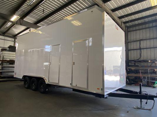 Custom crane trailer with front electrical room.