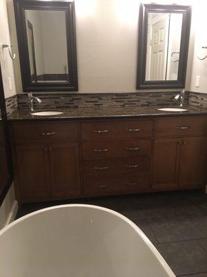 From the tub looking at vanity and backsplash.