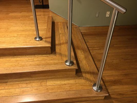 Commercial hardwood stairs with rail.