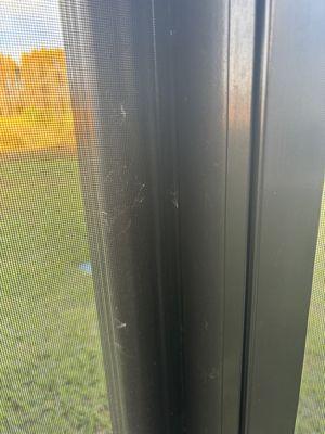 Spider webs still on my screen after their pressure wash