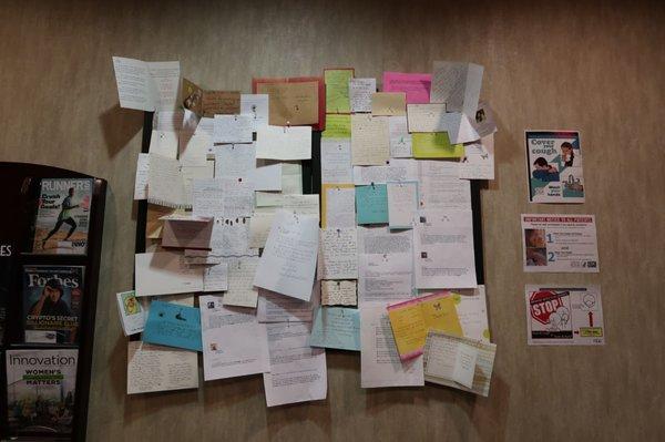 Wall of thank you cards and letters.