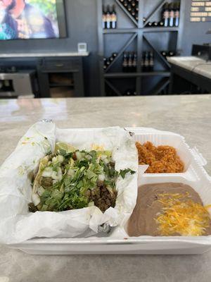 Steak, pastor and chicken tacos with a side of rice and beans!