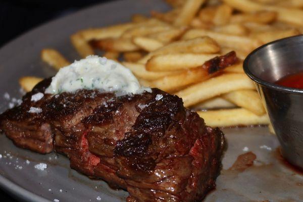 The Steak Frites were made with ribeye cap, bone marrow butter, arugula salad, & fries.