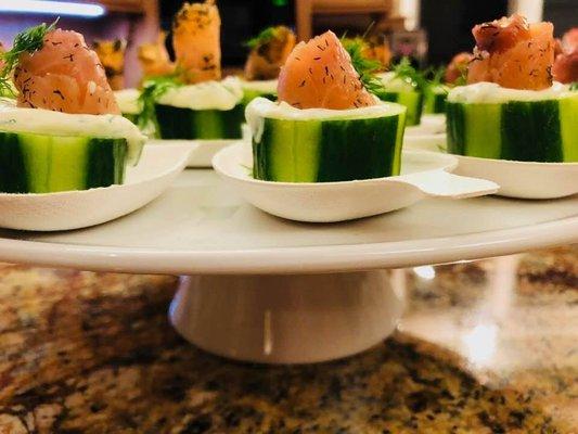 English cucumber cups with dill cream and salmon roses