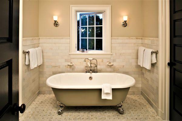 Bathroom in Charlevoix, Michigan residence with freestanding tub.  Design by Jonathan Lee Architects. #jlaarch