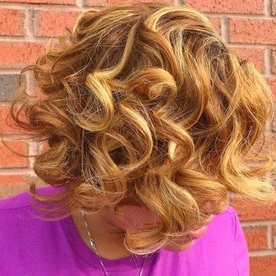 This color service is dimensional color with highlights for added lightness.