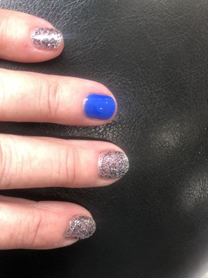 Black glitter with a blue accent nail