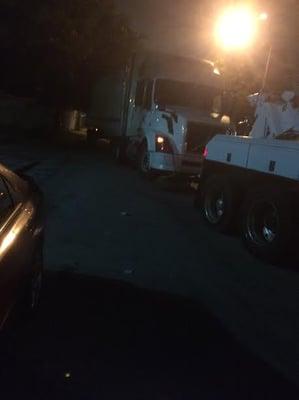 Tractor and 53FT Trailor Being Hauled by Banos Towing Heavy Duty