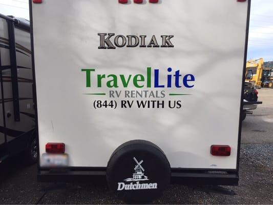 Vinyl lettering for TravelLite RV Rentals.