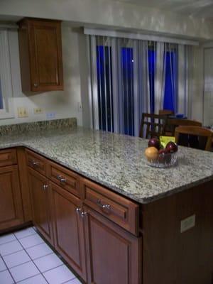 New granite countertop and refaced cabinets