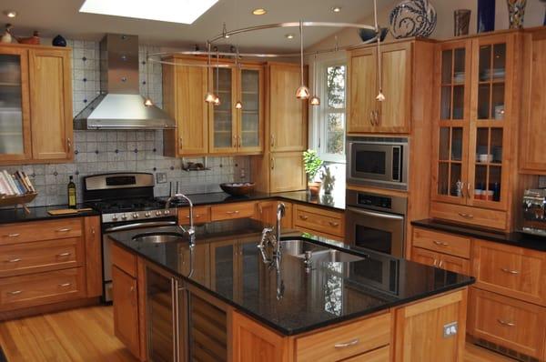 Custom Kitchen Addition with Maple cabinetry and black granite counters.