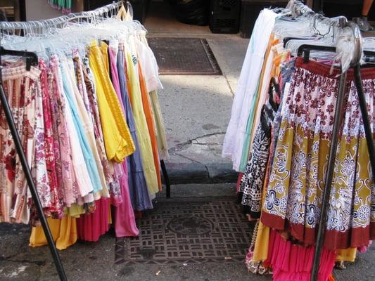 a vendor selling women's skirts