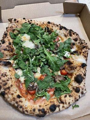 Mushroom, mozzarella, tomatoes, arugula with lite red sauce and garlic oil.