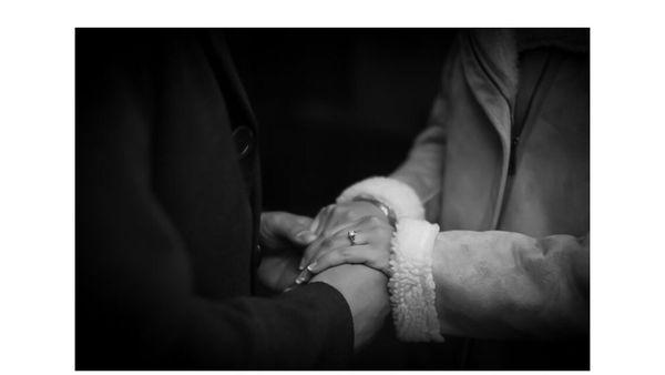 Husband and wife holding hands Photo by: Patrycja Zak