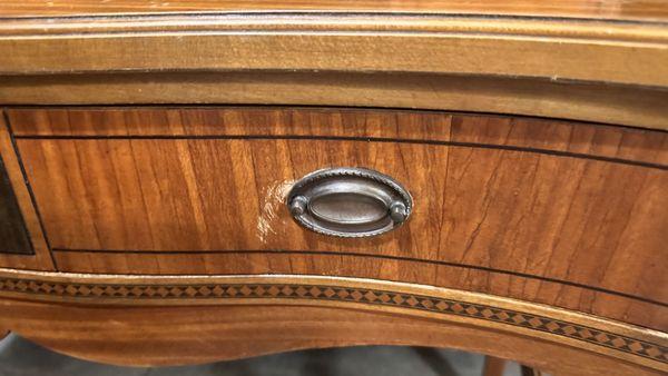 missing part of drawer pull and scratch on it